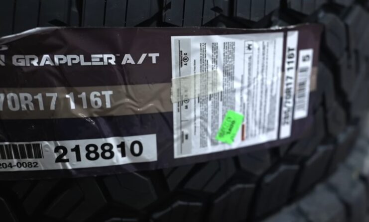 Detailed product information is clearly visible on the tire's label